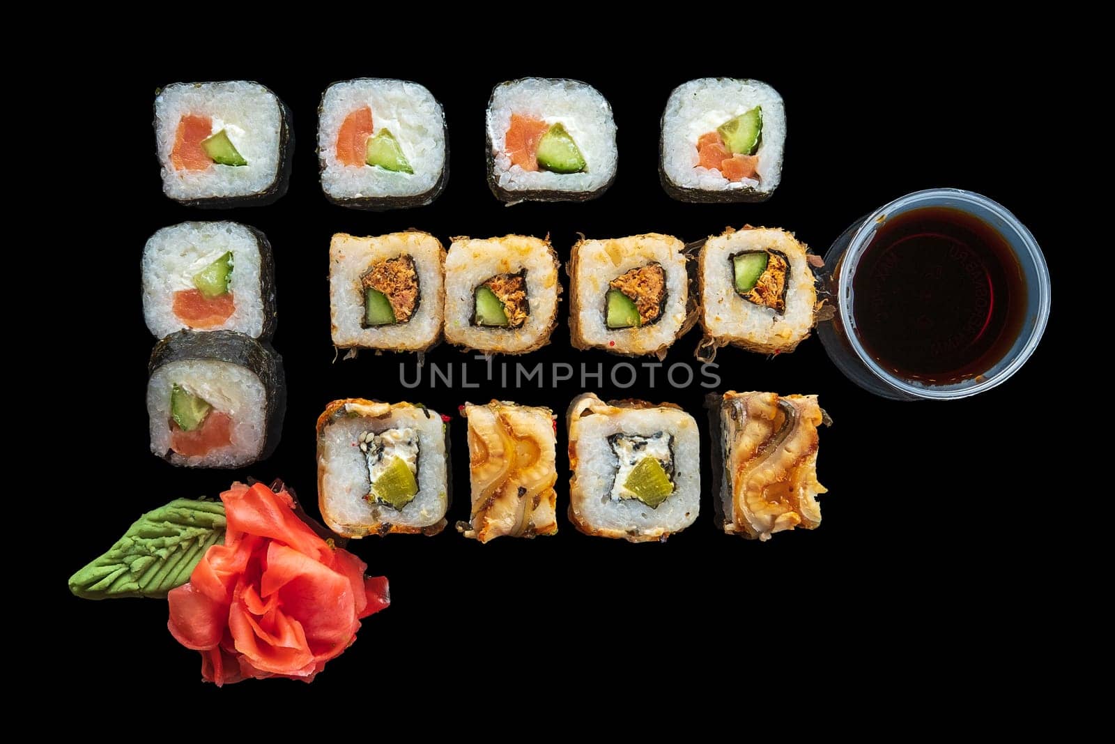 Top view of big set of rolls on black background