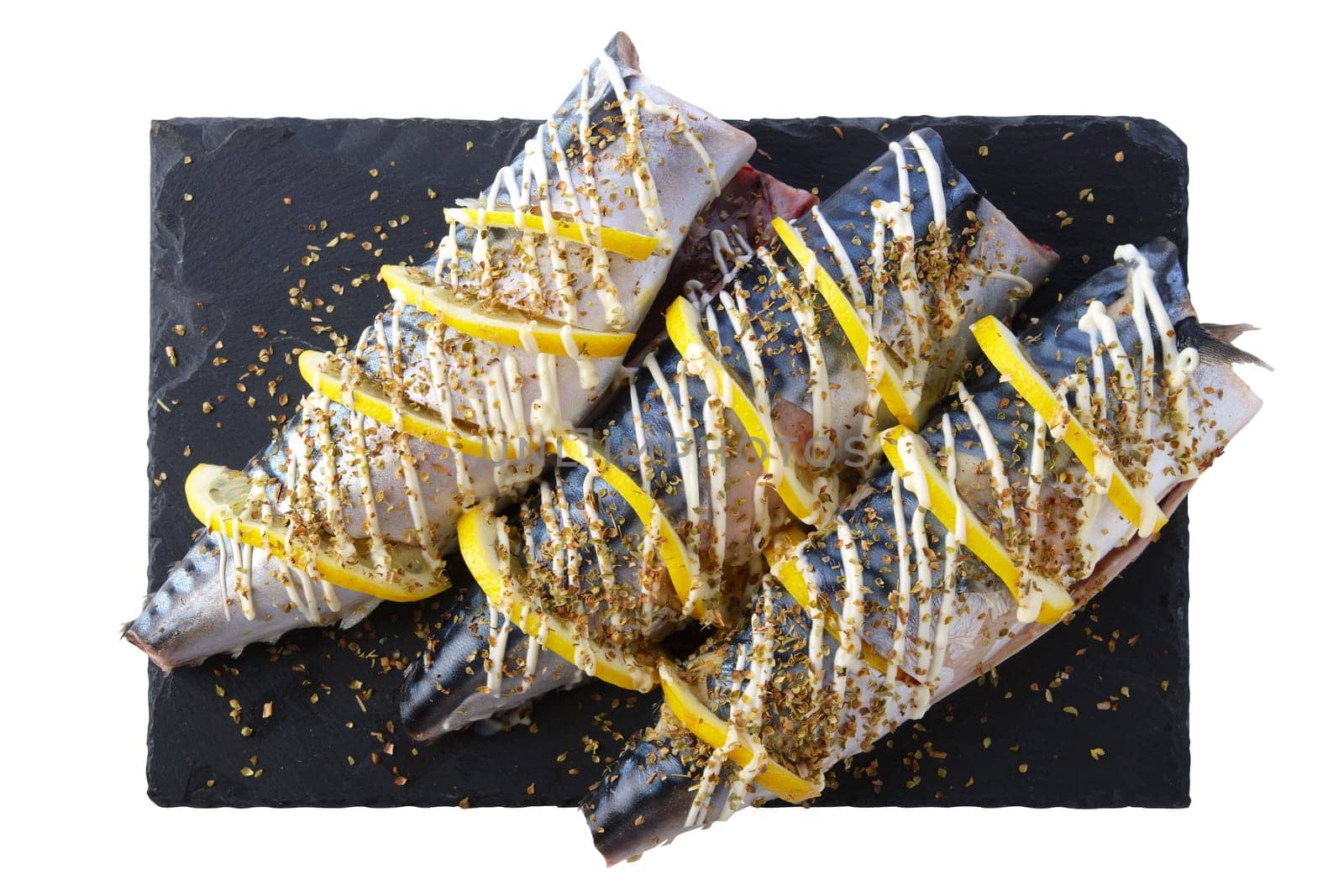 Fresh mackerel with spices and lemon ready for barbecue