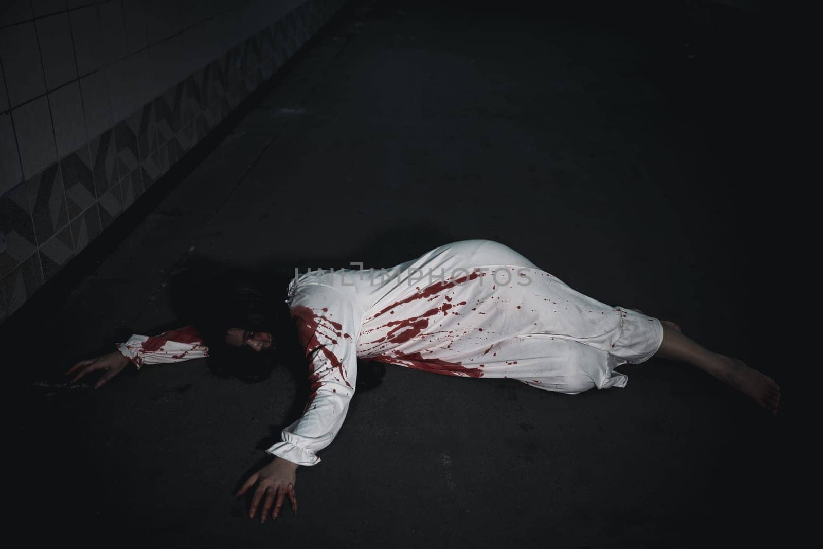 Horror bloodthirsty woman ghost horror she death and scary at dark night in tunnel, The girl was hit by a car and lying died on the road. full of blood left unattended, Happy halloween day festival