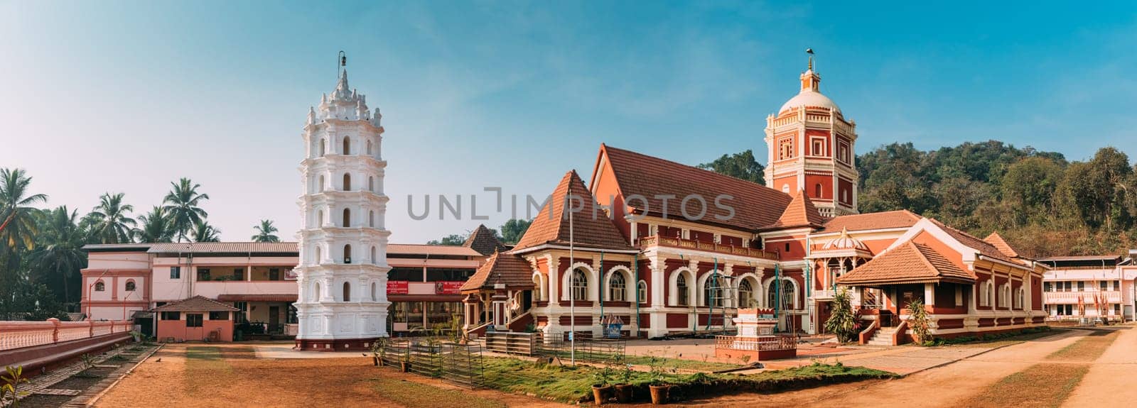 Kavlem, Phonda, Goa, India. Shree Shantadurga Mandir, Kavlem Temple. Famous Landmark And Popular Destination. White Lamp Tower. Shantadurga Devi. Panorama, Panoramic View.