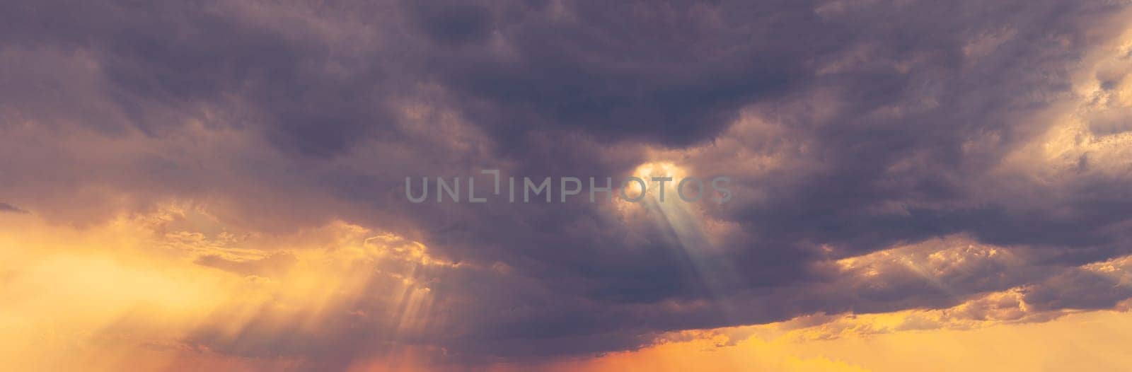 Sunshine In Sunrise Bright Dramatic Sky. Sun Ray Through Dark Rainy Clouds. Scenic Colorful Sky At Dawn. Sunset Sky Natural Abstract Background. Panorama.