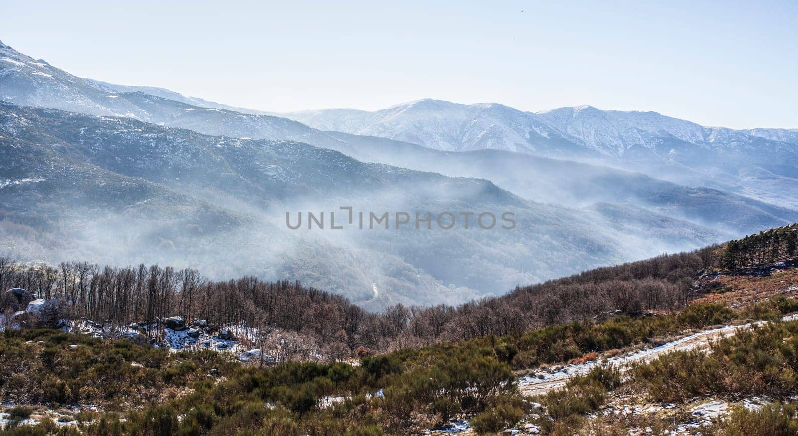 Fog ambient between snowy peaks of the Sierra de Gredos. La Garganta, Ambroz Valley, Extremadura, Caceres, Spain