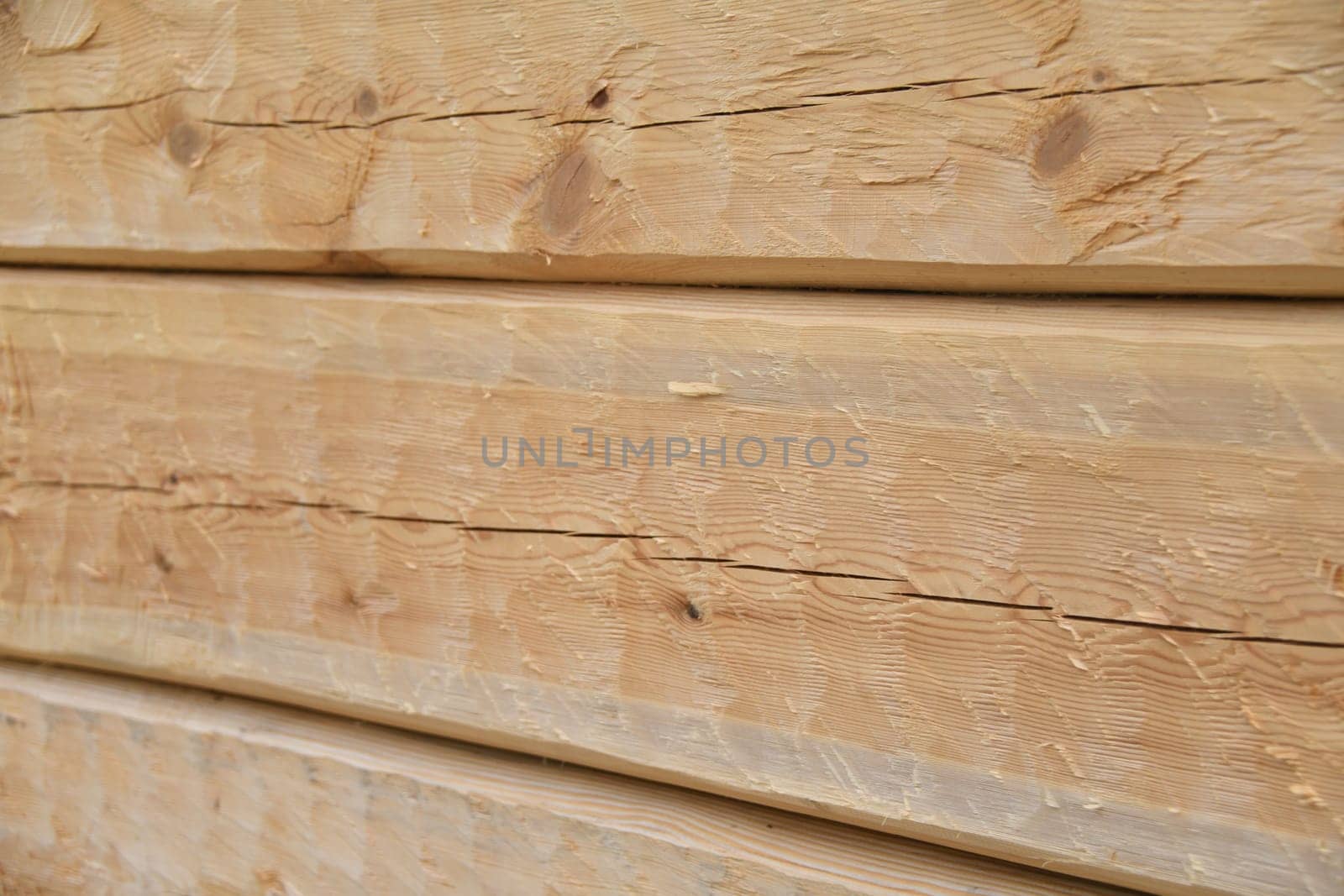 Beveled pine in the raw state as a background. The pine is a softwood. The wood is coated with linseed oil balsam turpentine and thus made more durable.