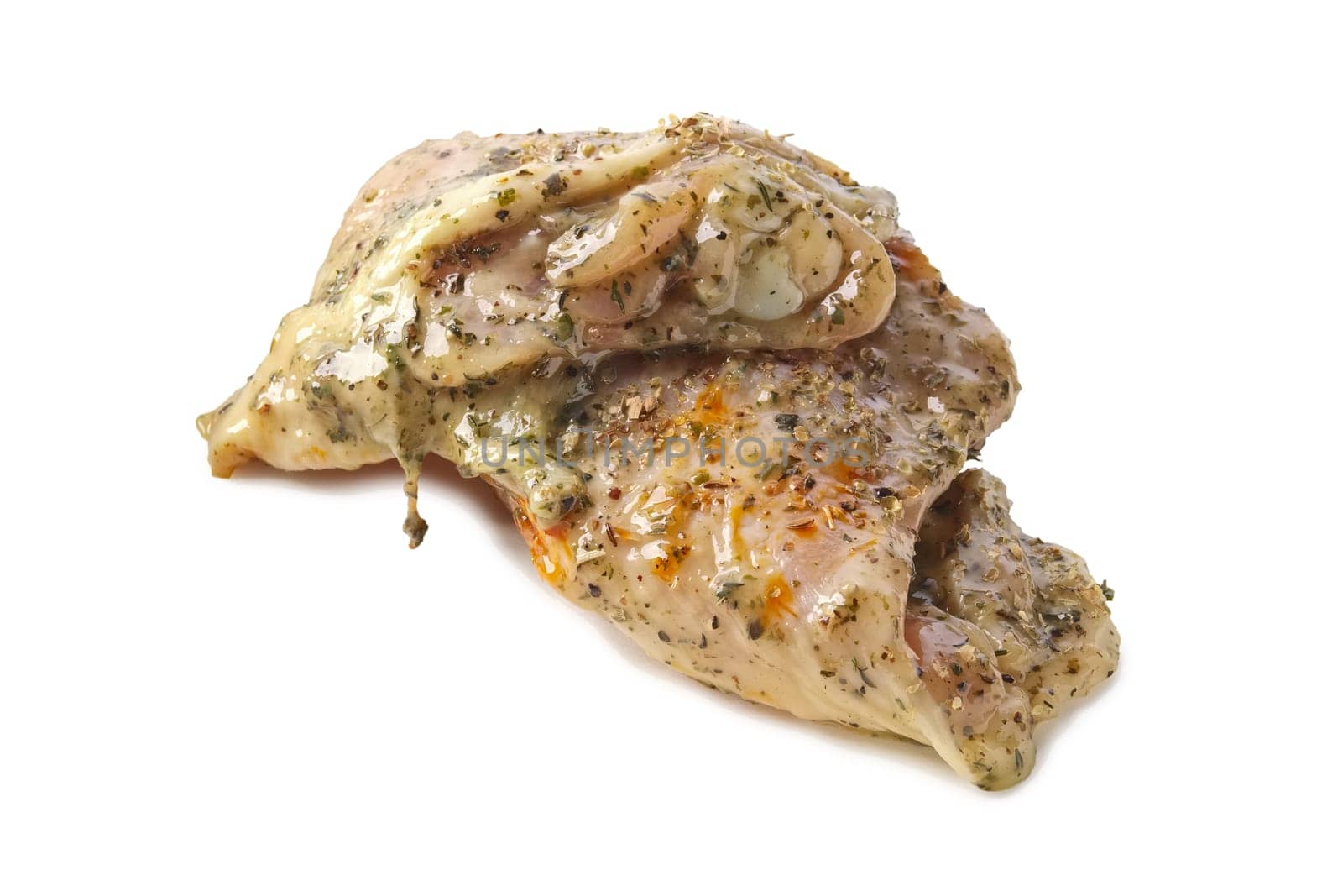 Raw piece of chicken with spice and sauce prepered for barbecue. Gastronomy template isolated on white background.