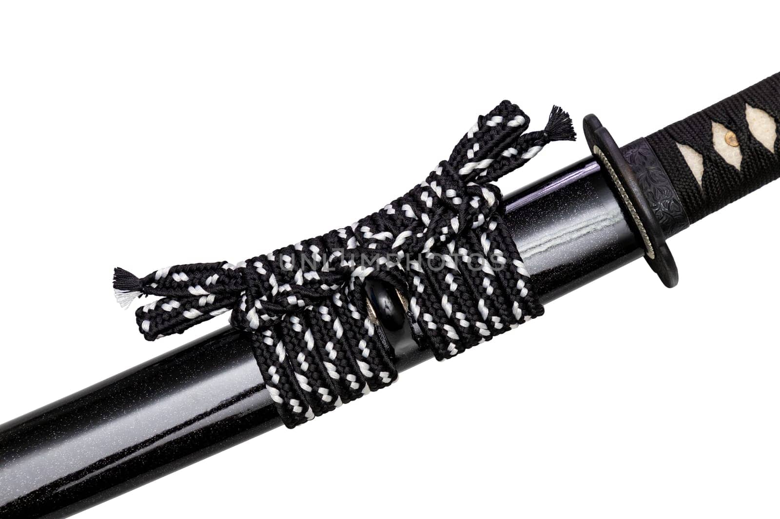 Close up shot of Sageo - Thick black-white silk rope for tying the scabbard of Japanese swords. It was a rope for the samurai to tie at the waist. isolated on white background. Selective focus.