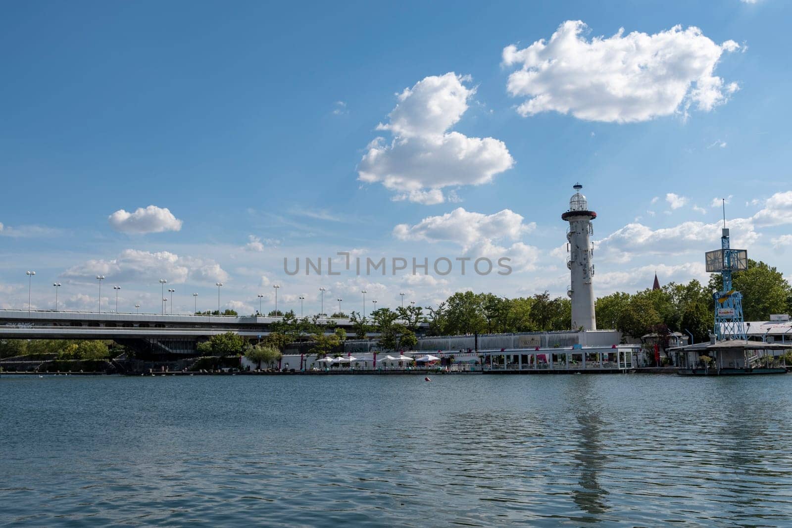 Vienna, Austria - August 10, 2022: The Viennese use them to relax, in bars and restaurants along the Old Danube or at Copa Beach and Sunken City on Danube Island.