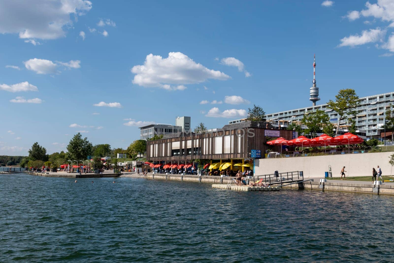 Vienna, Austria - August 10, 2022: The Viennese use them to relax, in bars and restaurants along the Old Danube or at Copa Beach and Sunken City on Danube Island.