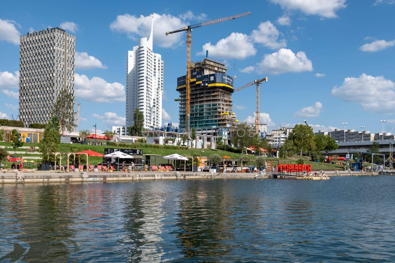 Vienna, Austria - August 10, 2022: The Viennese use them to relax, in bars and restaurants along the Old Danube or at Copa Beach and Sunken City on Danube Island.