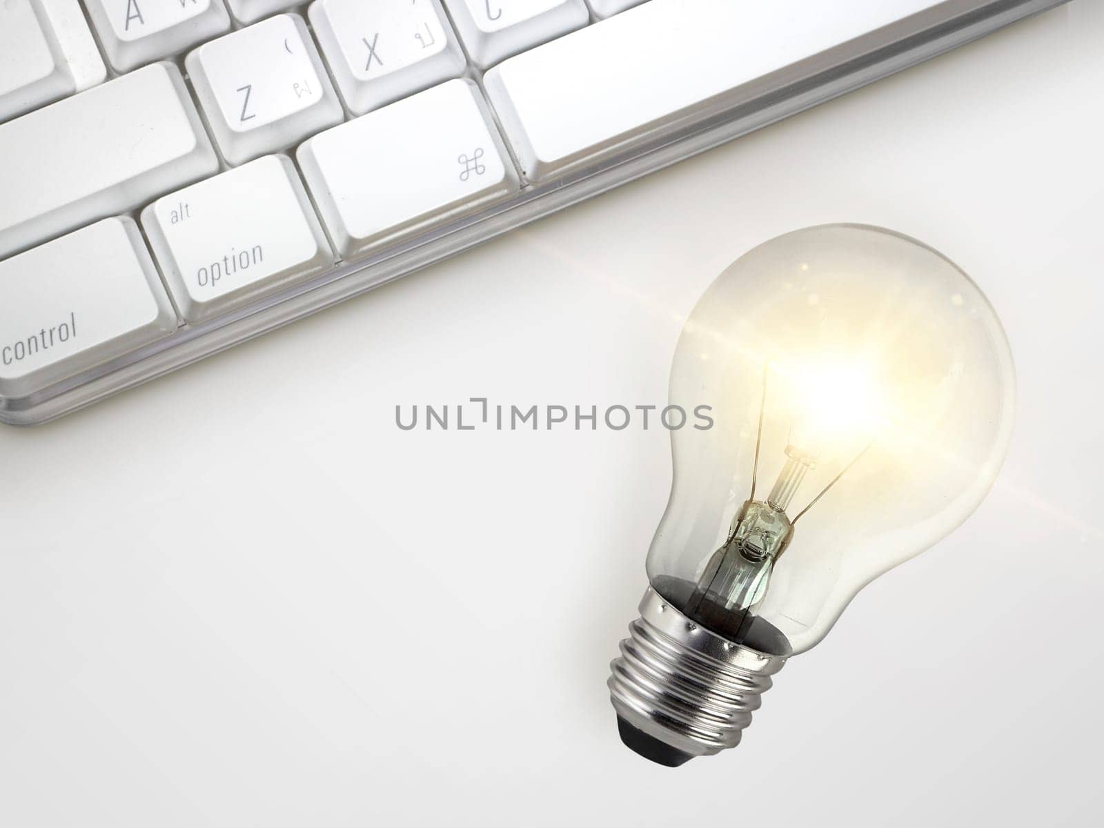 Laptop and glowing light bulb. Self learning or education knowledge and business studying concept. Idea of learning online or e-learning from home