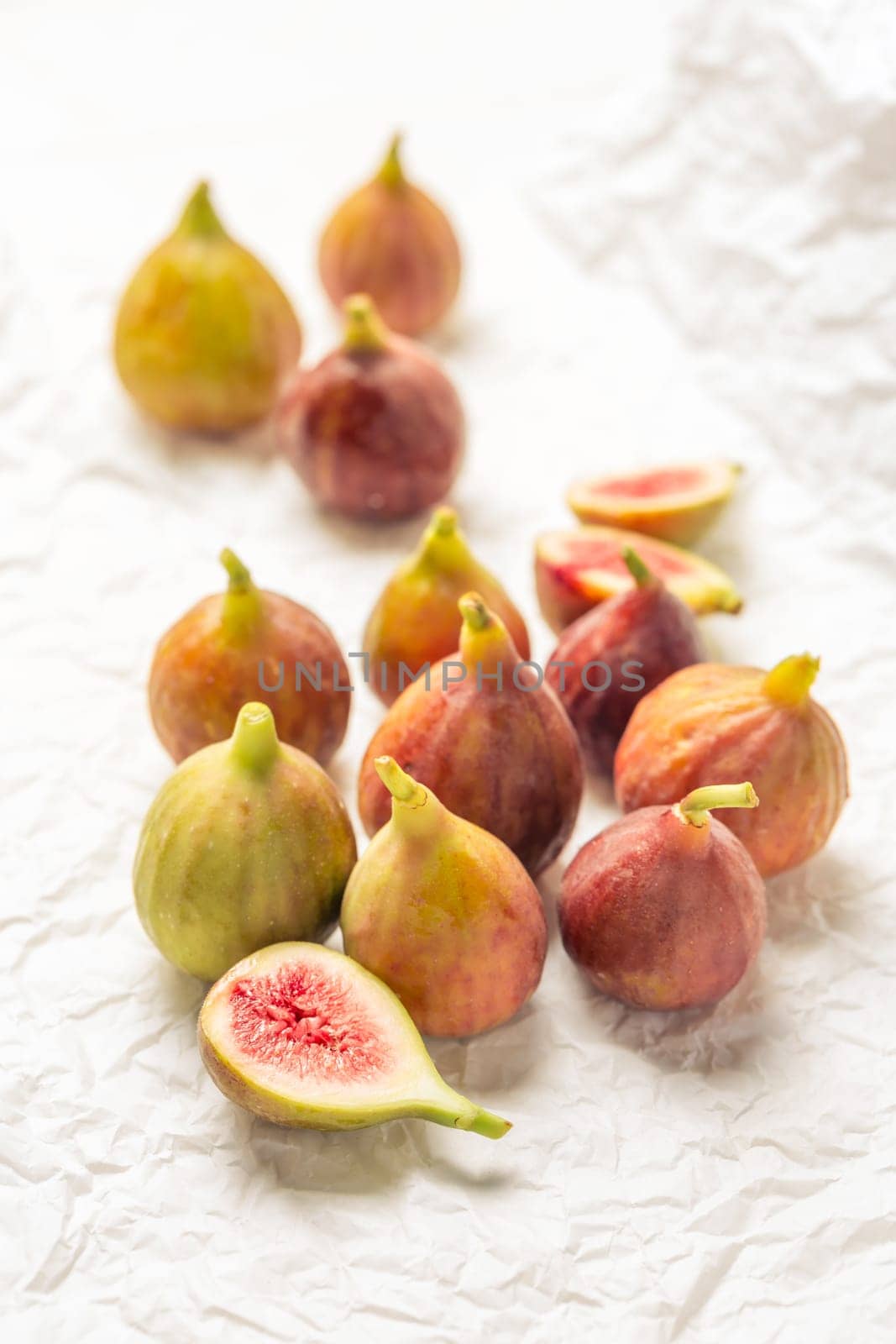 Tasty organic figs on white background