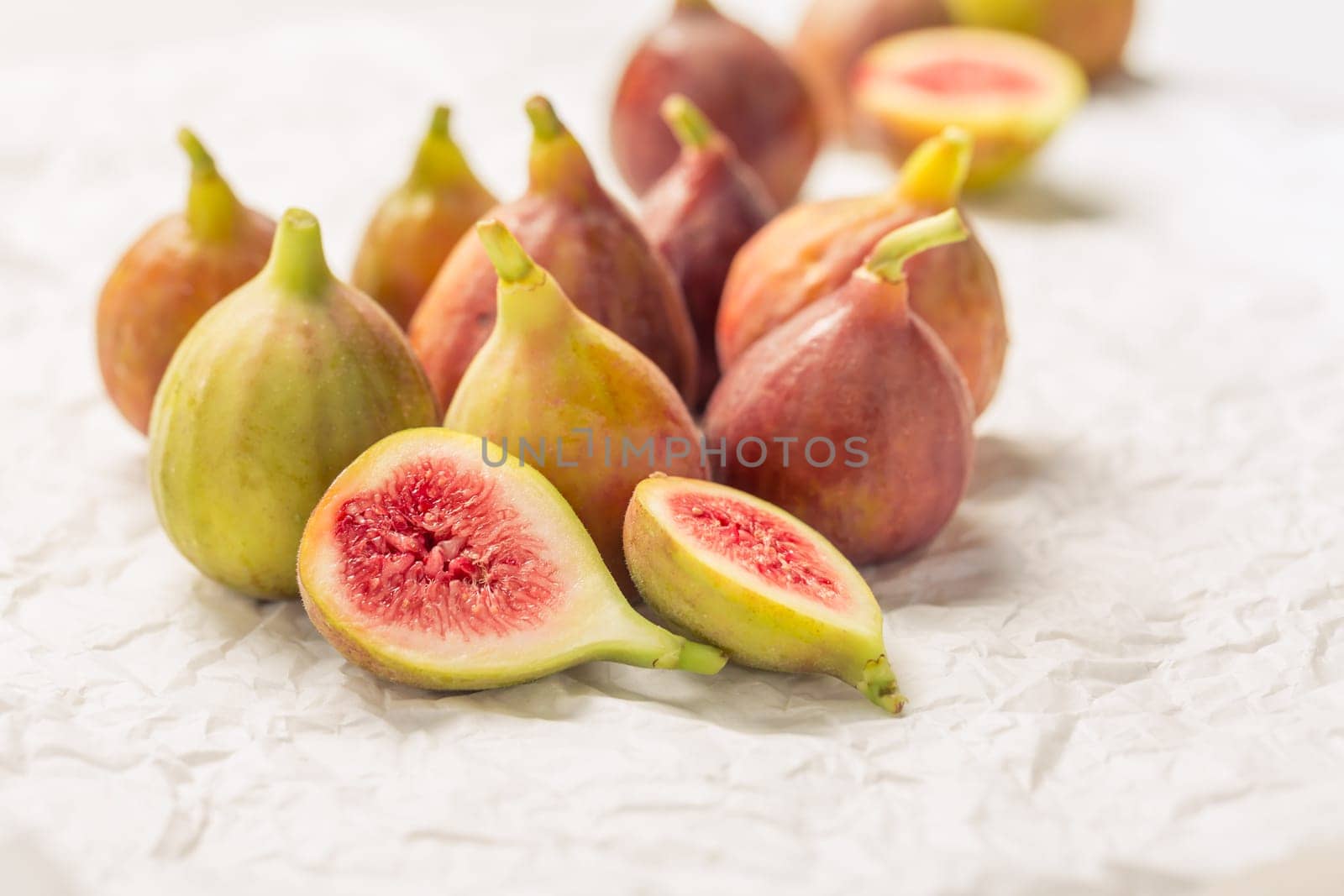 Tasty organic figs on white background