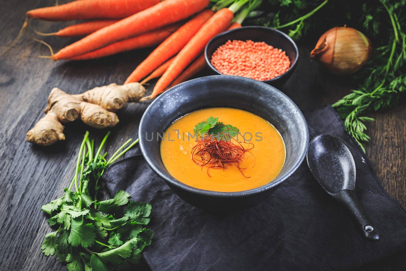 Roasted pumpkin and carrot soup with red lentils, ginger and chili