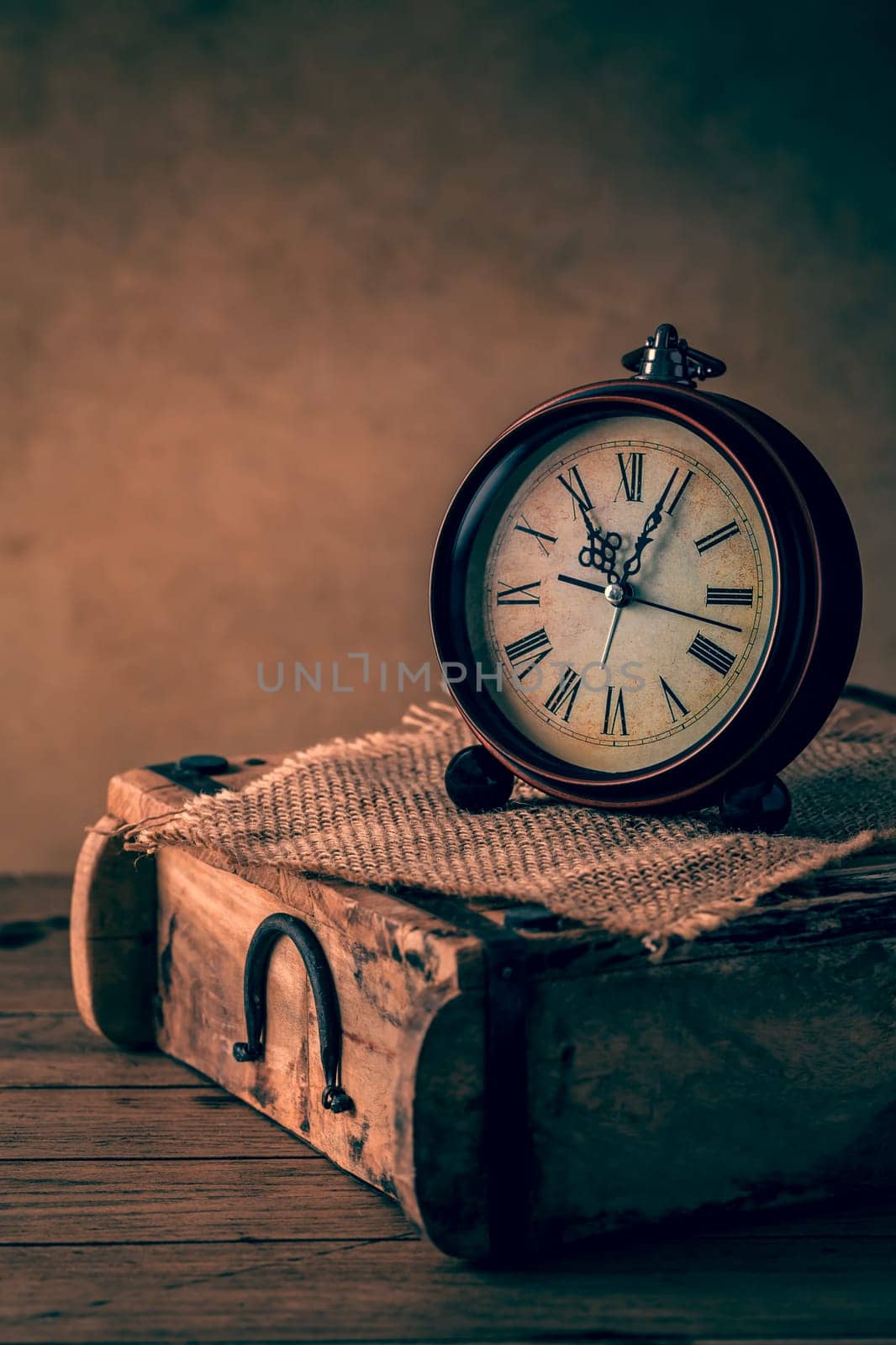 Vintage alarm clock with copy space. Photo in retro color image style