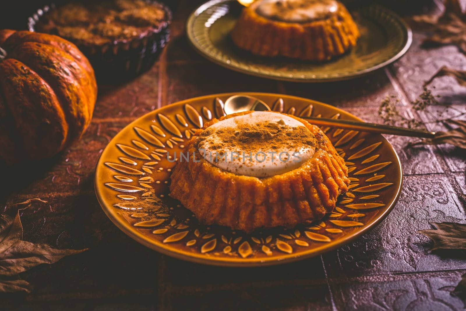 Pumpkin mini pie, tartlet made for Thanksgiving day on old wooden background. Healthy autumn food concept
