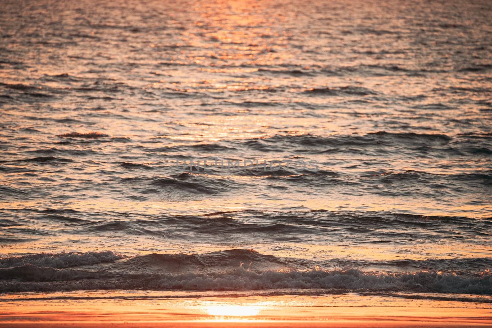 Sea Water Surface At Sunset. Natural Sunrise Warm Colors Of Ocean.