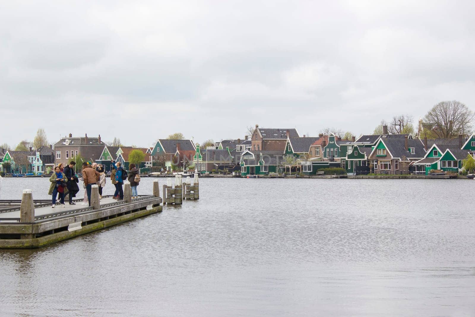 Zaanse Schans - APRIL 16, 2022: Traditional Houses in the Historic Village of Zaanse Schans on the Zaan River in the Netherlands