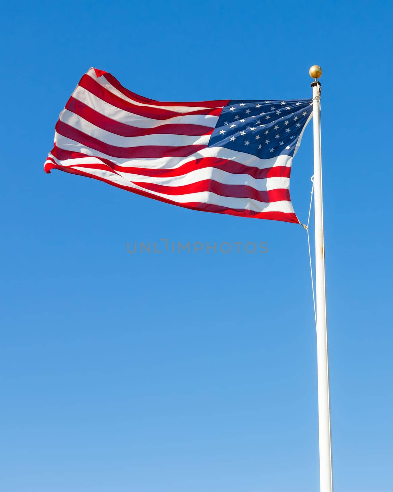 American flag against blue sky