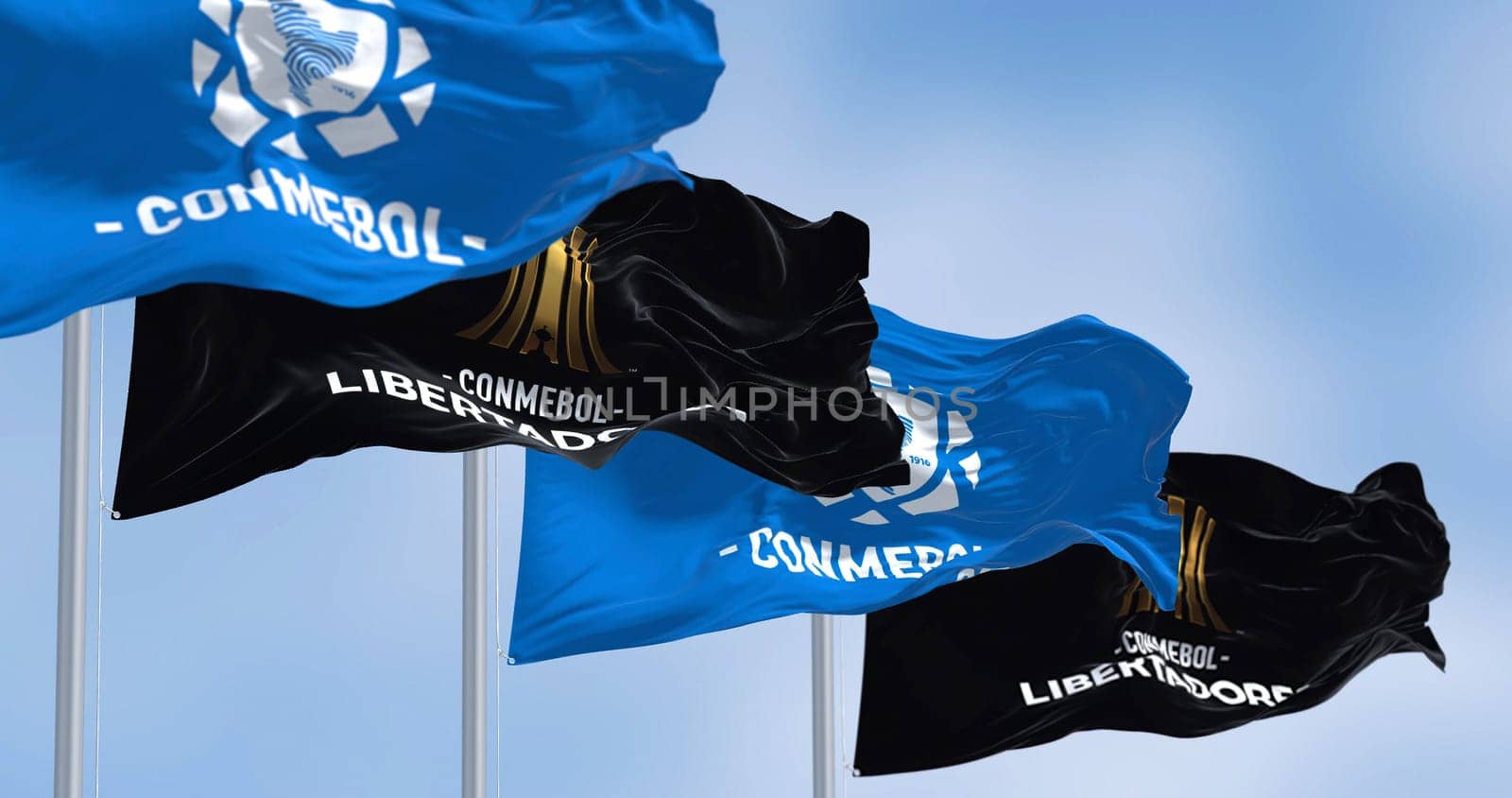 Buenos Aires, ARG, Sept 2022: Flags with the CONMEBOL and Libertadores logo waving. CONMEBOL Libertadores is a South American football competition for club teams and is organized annually by CONMEBOL