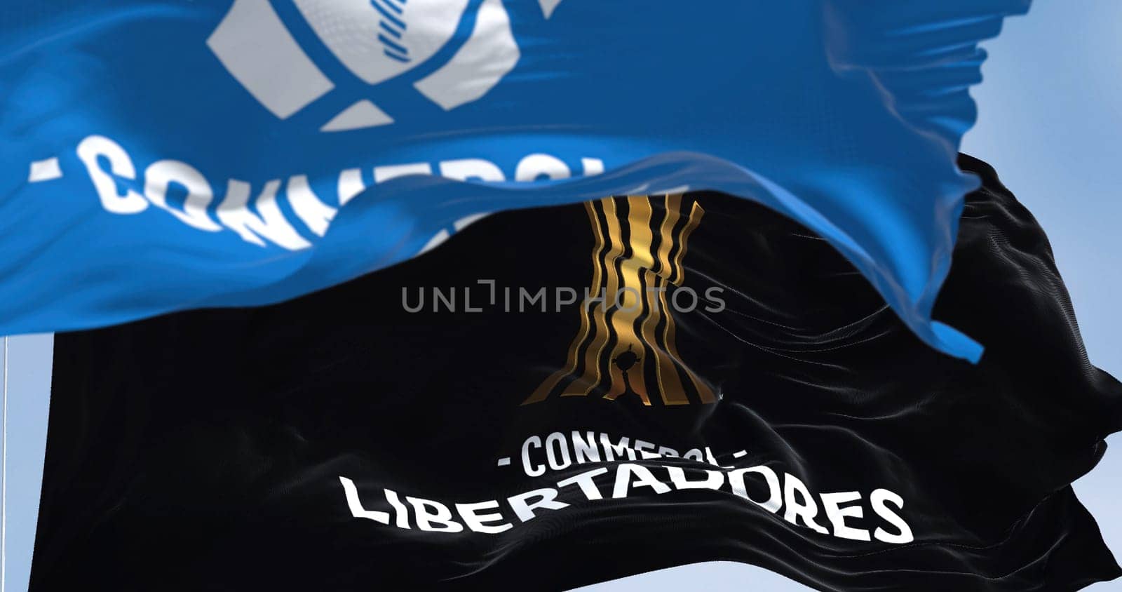 Buenos Aires, ARG, Sept 2022: Flags with the CONMEBOL and Libertadores logo waving. CONMEBOL Libertadores is a South American football competition for club teams and is organized annually by CONMEBOL