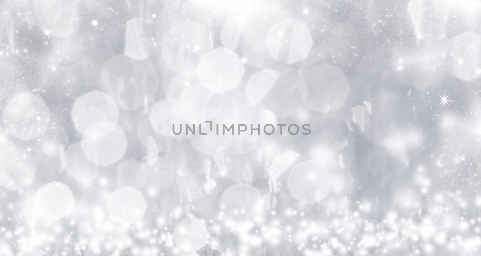 Light silver abstract Christmas background with white snowflakes