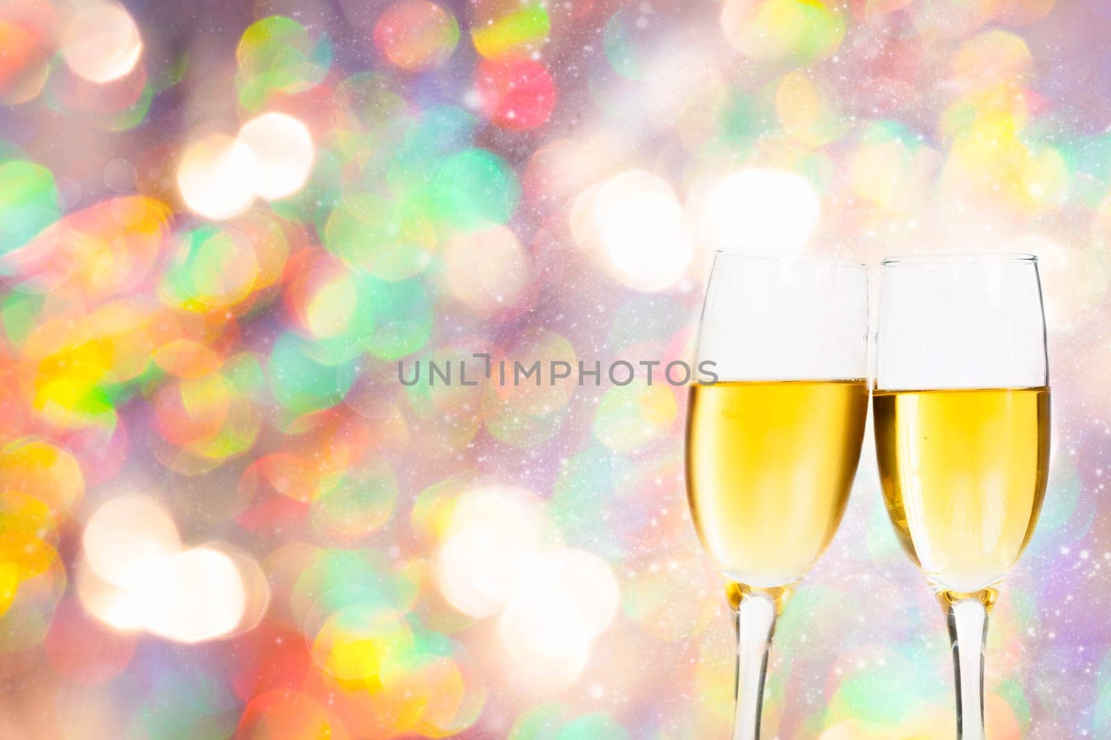 Champangne glasses on sparkling background