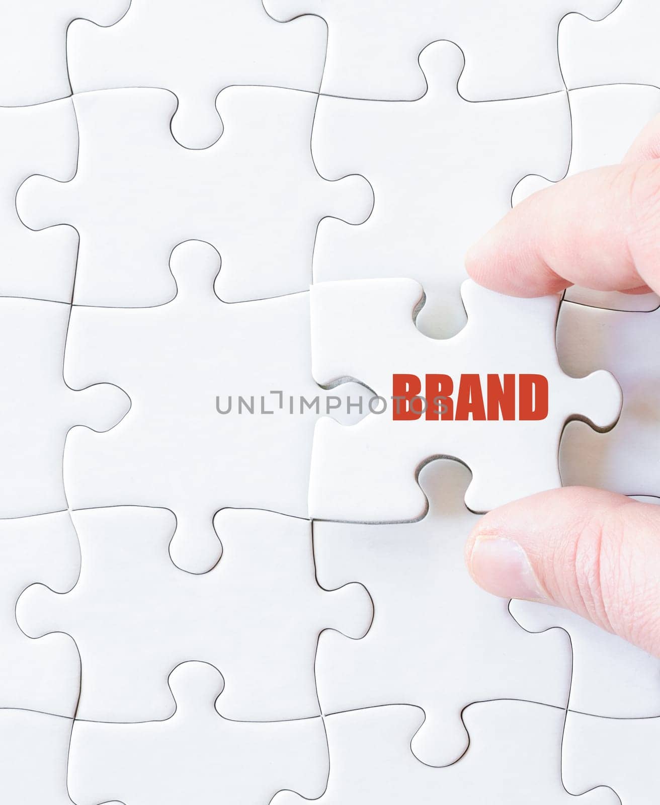 Missing jigsaw puzzle piece with word BRAND. Business concept image for completing the puzzle.