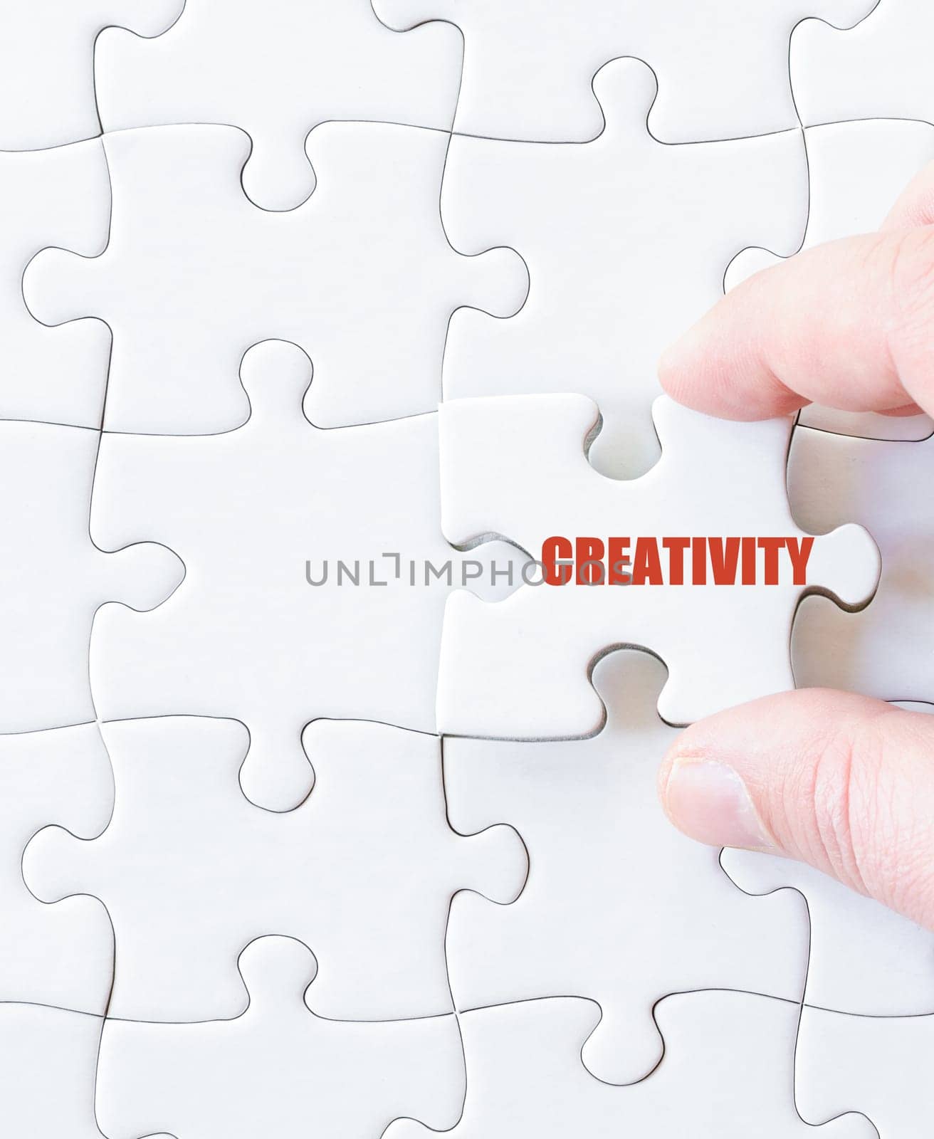 Missing jigsaw puzzle piece with word CREATIVITY. Business concept image for completing the puzzle.