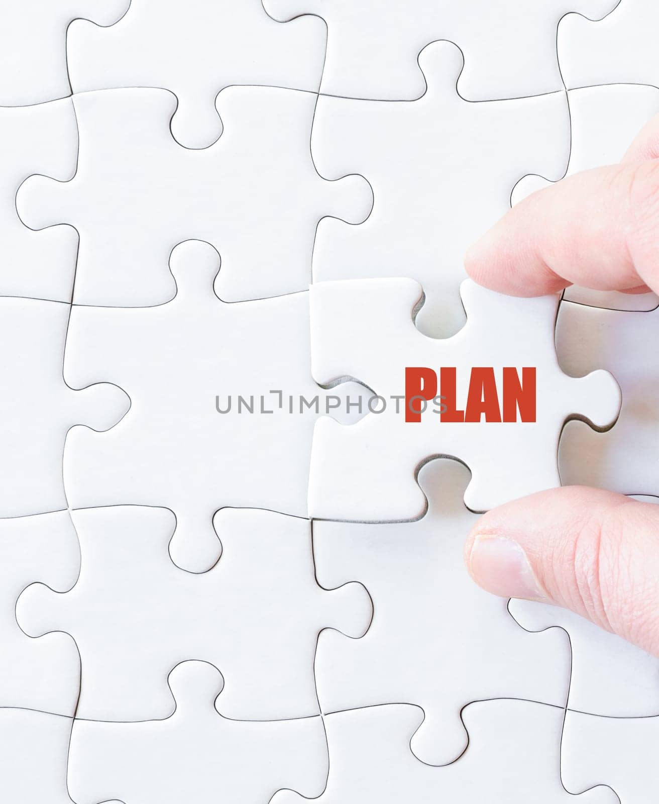 Missing jigsaw puzzle piece with word PLAN. Business concept image for completing the puzzle.