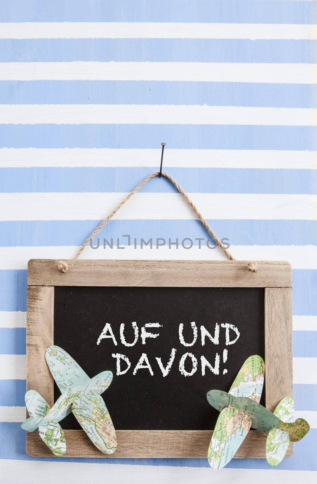 Rustic chalk tadel on striped background with paper planes