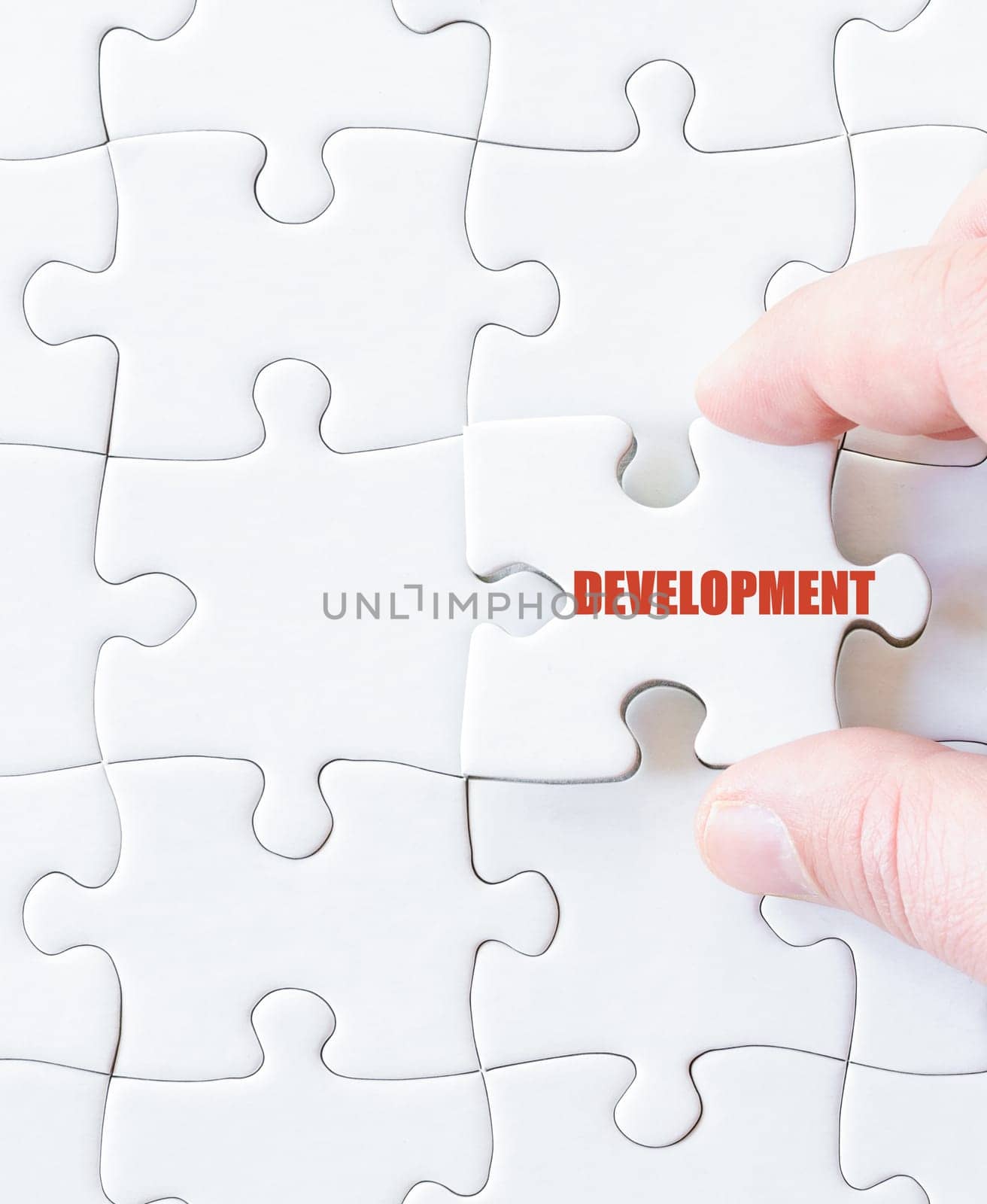 Missing jigsaw puzzle piece with word DEVELOPMENT. Business concept image for completing the puzzle.