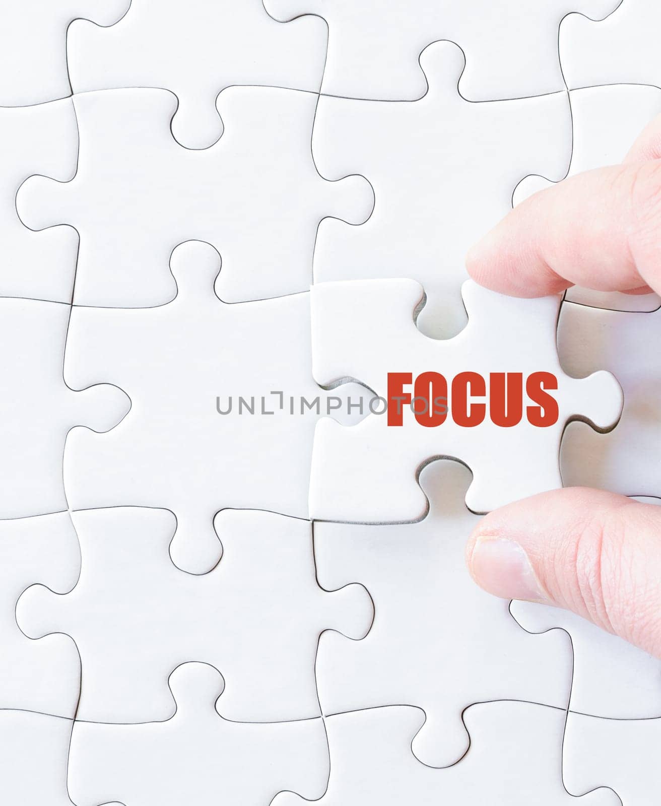 Missing jigsaw puzzle piece with word  FOCUS. Business concept image for completing the puzzle.
