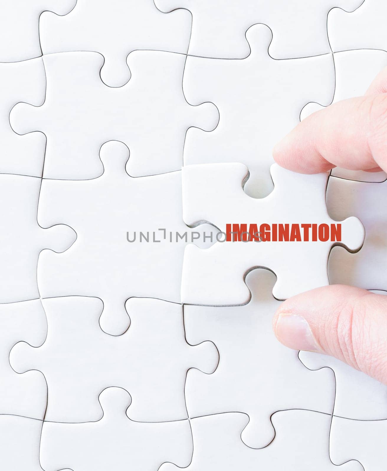 Missing jigsaw puzzle piece with word IMAGINATION. Business concept image for completing the puzzle.