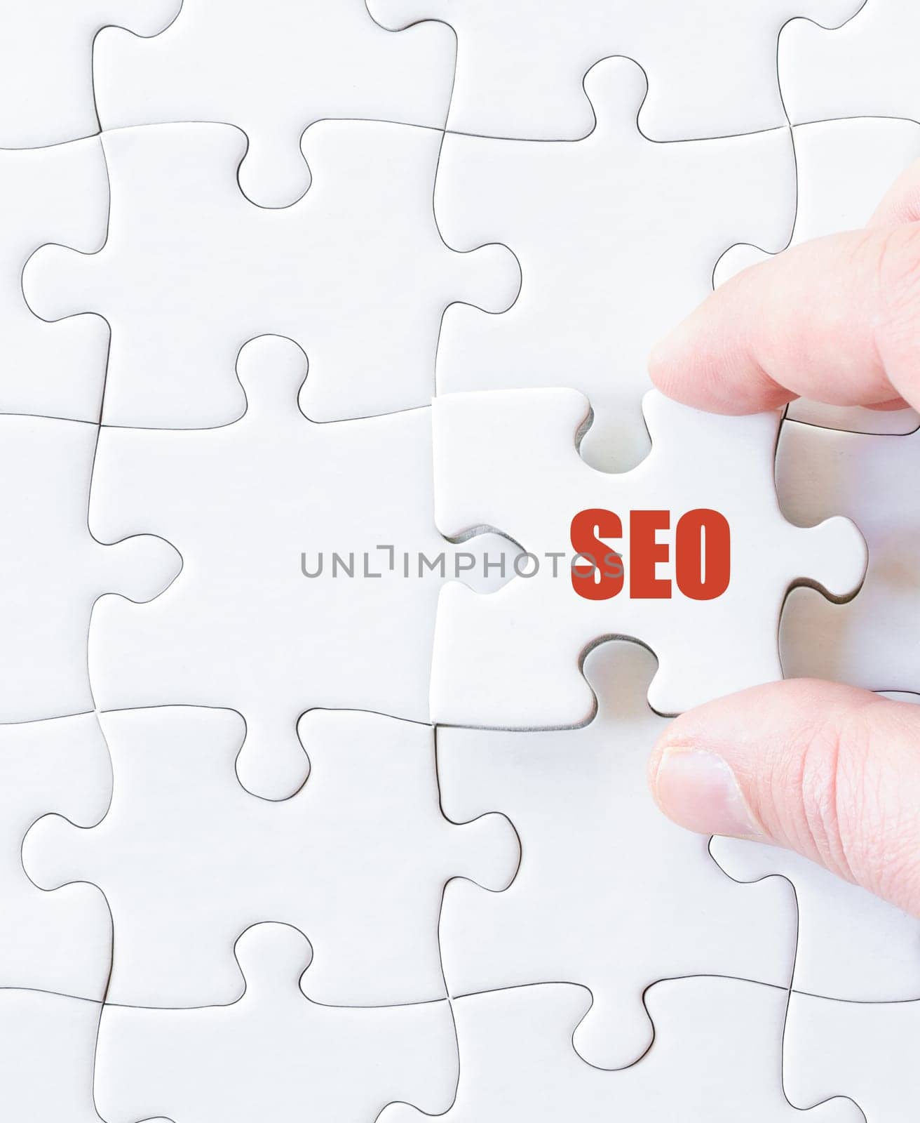 Missing jigsaw puzzle piece with word SEO. Business concept image for completing the puzzle.