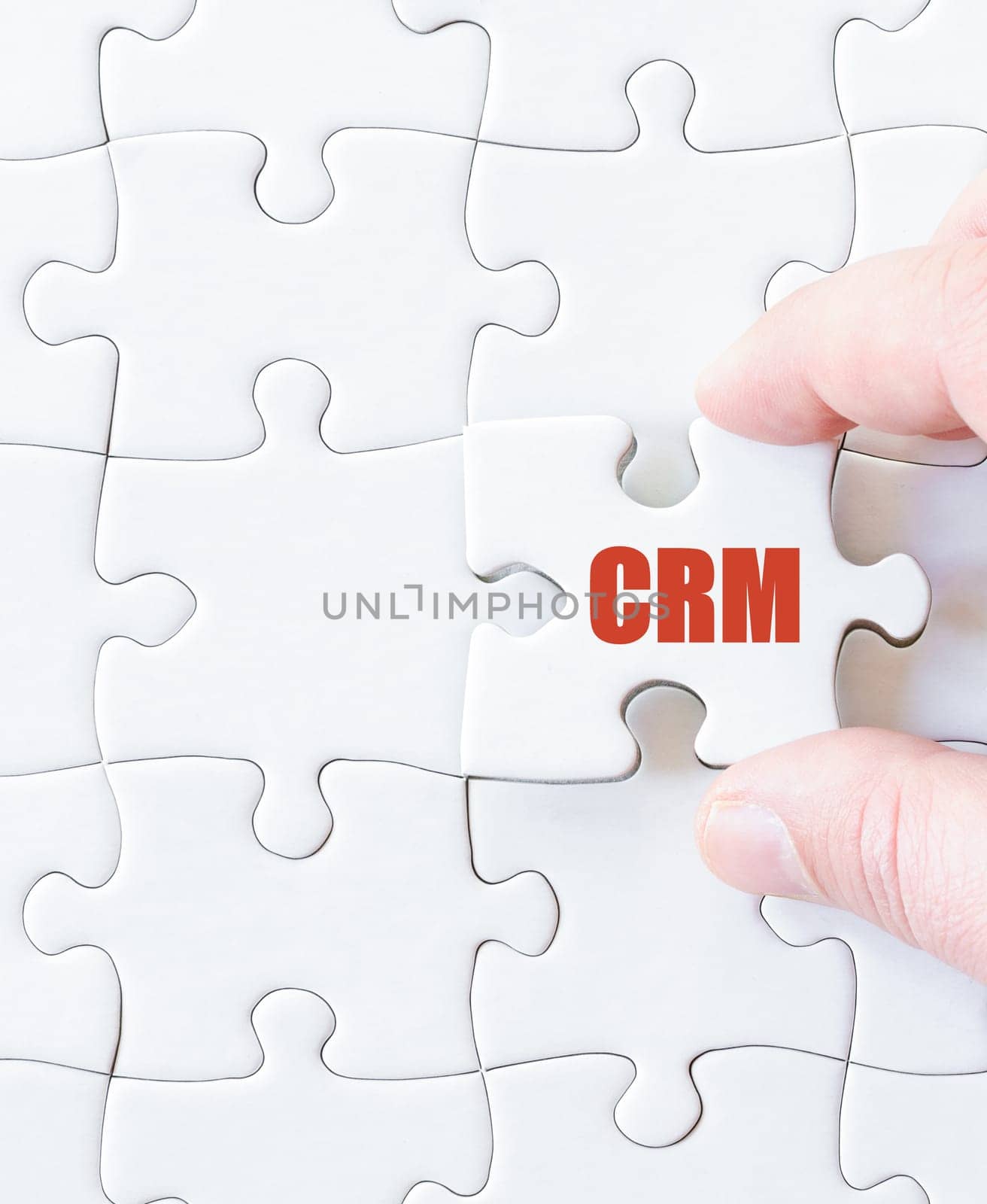 Missing jigsaw puzzle piece with word  CRM. Business concept image for completing the puzzle.