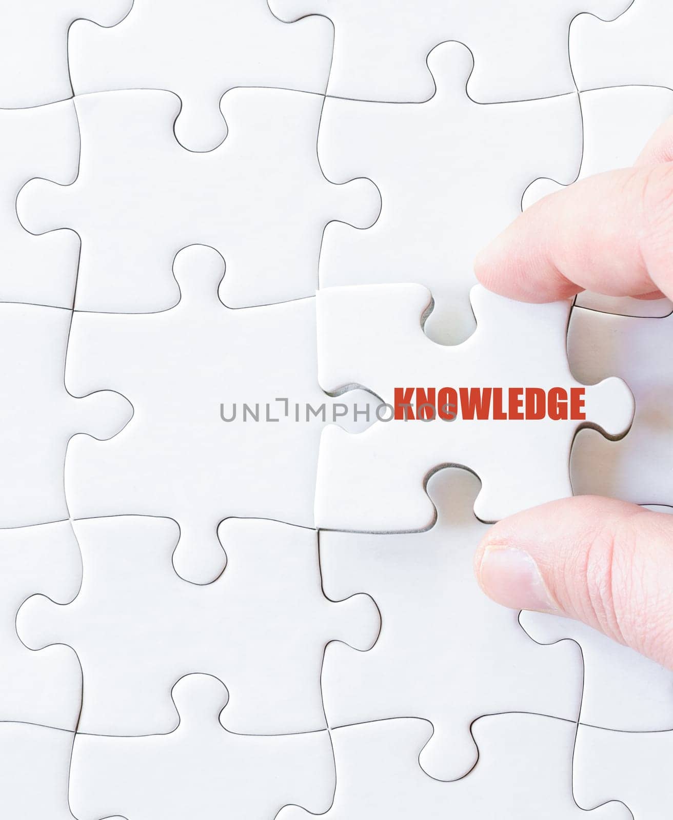 Missing jigsaw puzzle piece with word KNOWLEDGE. Business concept image for completing the puzzle.
