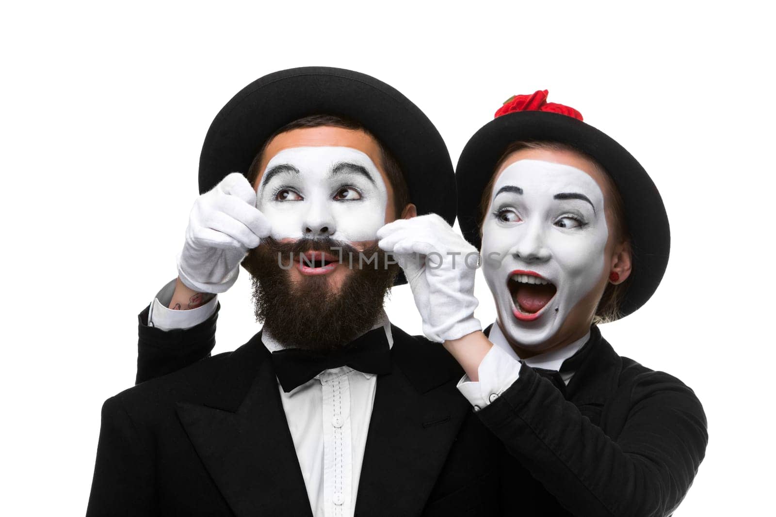 Two memes as businessmen. woman making a face man adjusting his mustache, isolated on a white background. Conceptual sense - the ability to keep a person