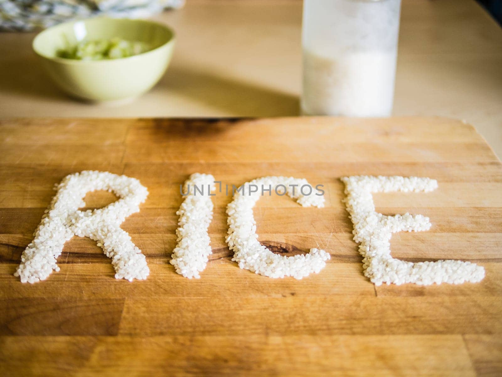 Rice word made of rice on wooden board