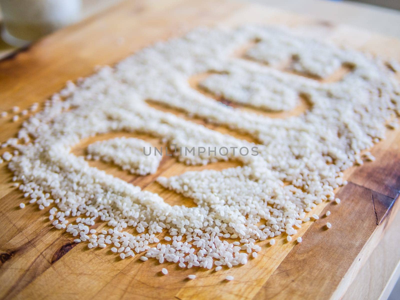 Rice word made of rice on wooden board