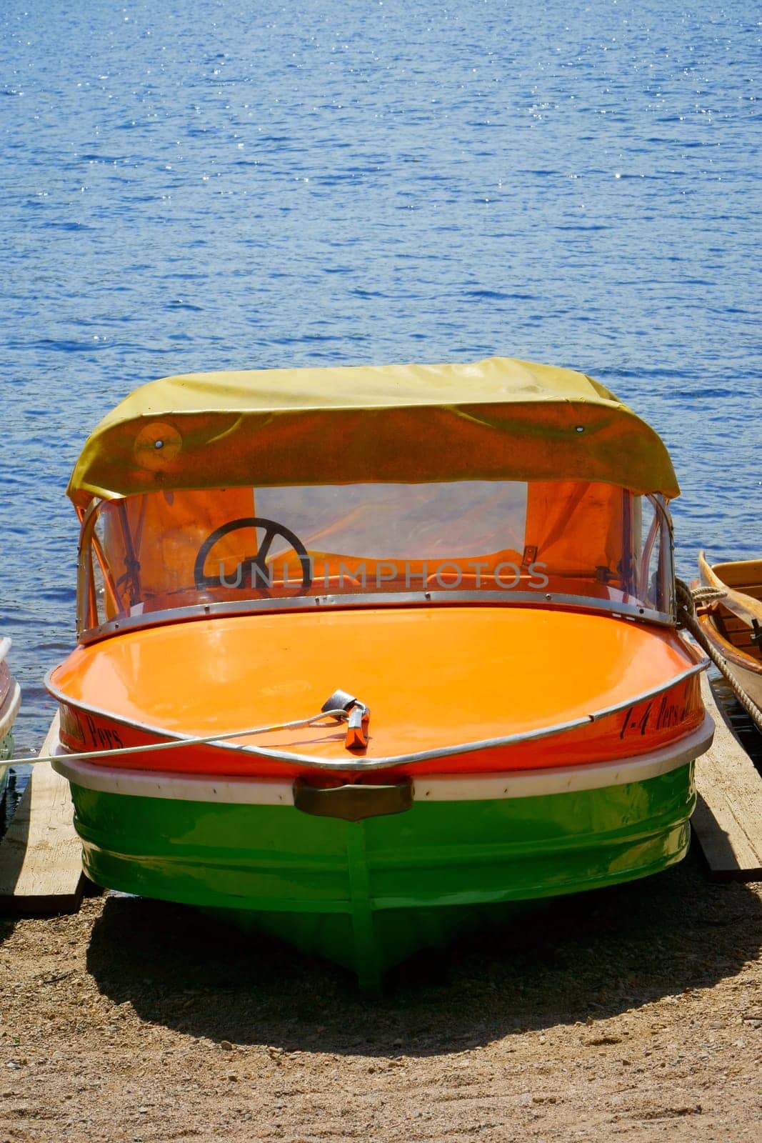 Single pedal boat at the shore of the lake Titisee
