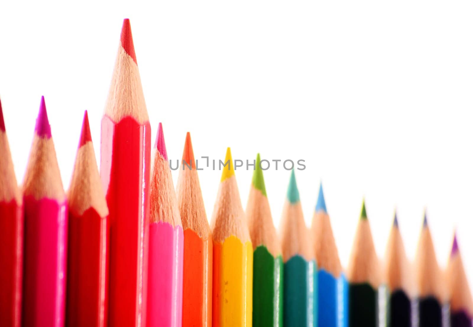 Composition with colorful crayons isolated on white background