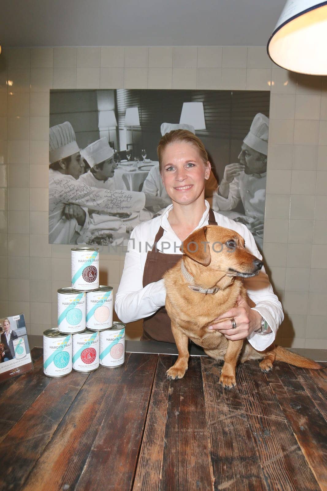 Cornelia Poletto with dachshund "Franz"" (7 years old from the shelter),press event for the start of the ""HARDYS TRAUM EDITION CORNELIA POLETTO"" dog food,in the Cucina Cornelia Poletto,Hamburg,19.05.2015"