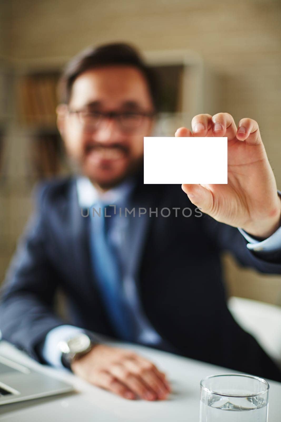 Hand of businessman with blank card introducing himself to partner