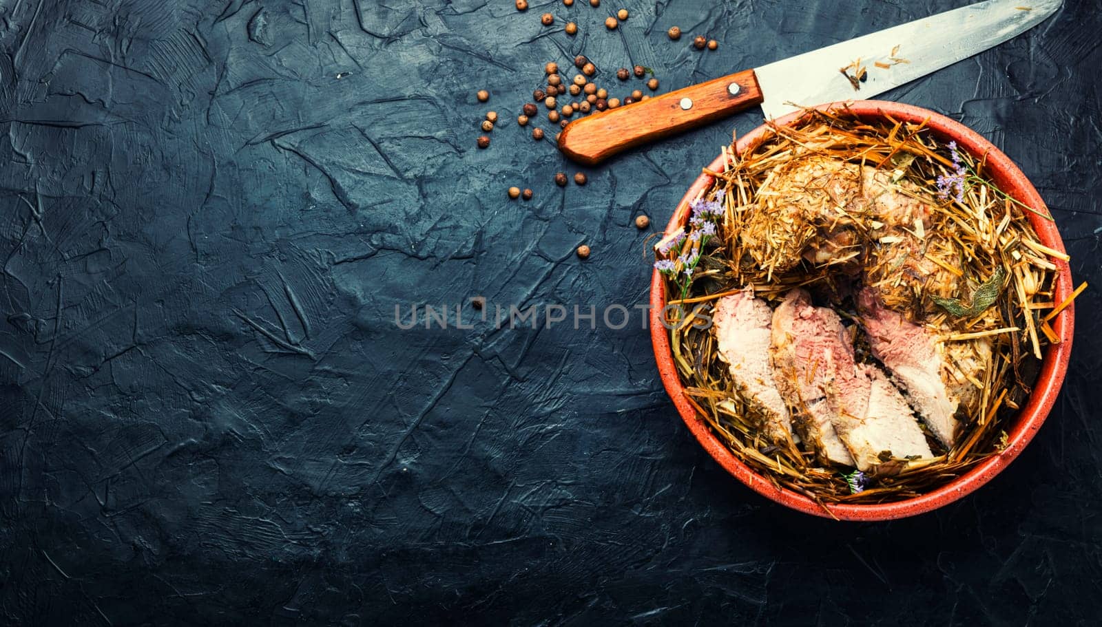 Meat braised in fresh hay.Roasted pork loin in hays.Roasted pork shoulder