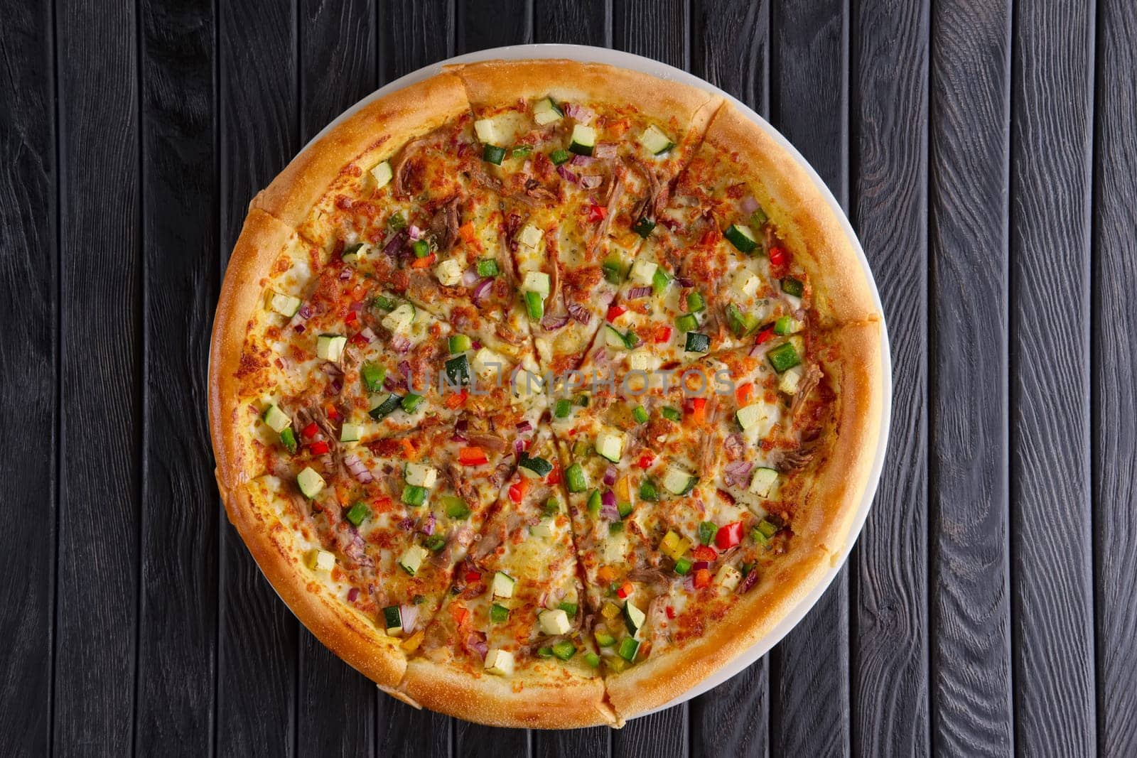 Pizza with ground-meat and vegetables, top view