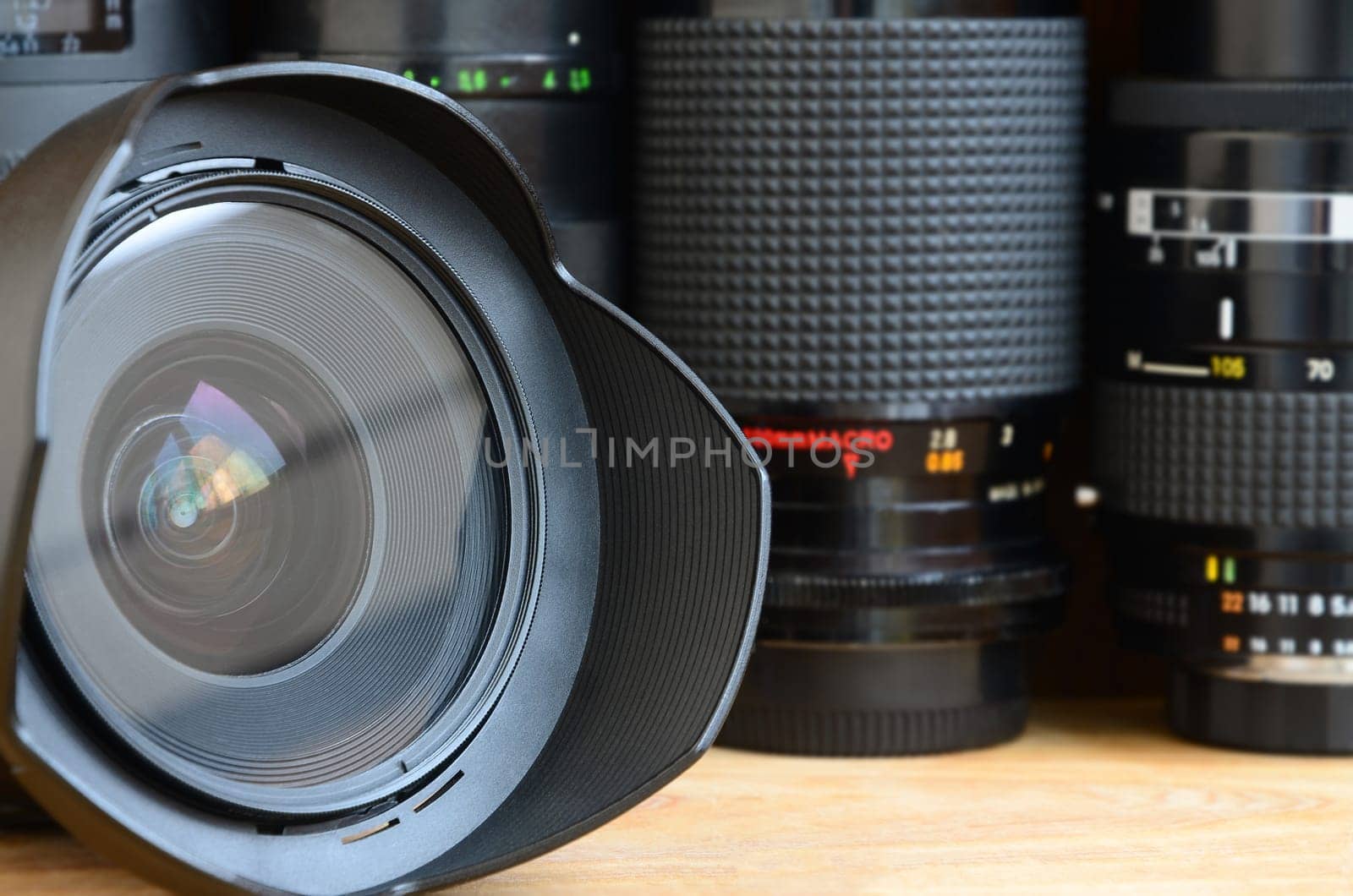 Professional photo art equipment. Assortment of modern lenses. Thematically for the sale or rental of photographic equipment and the presentation of photo lessons