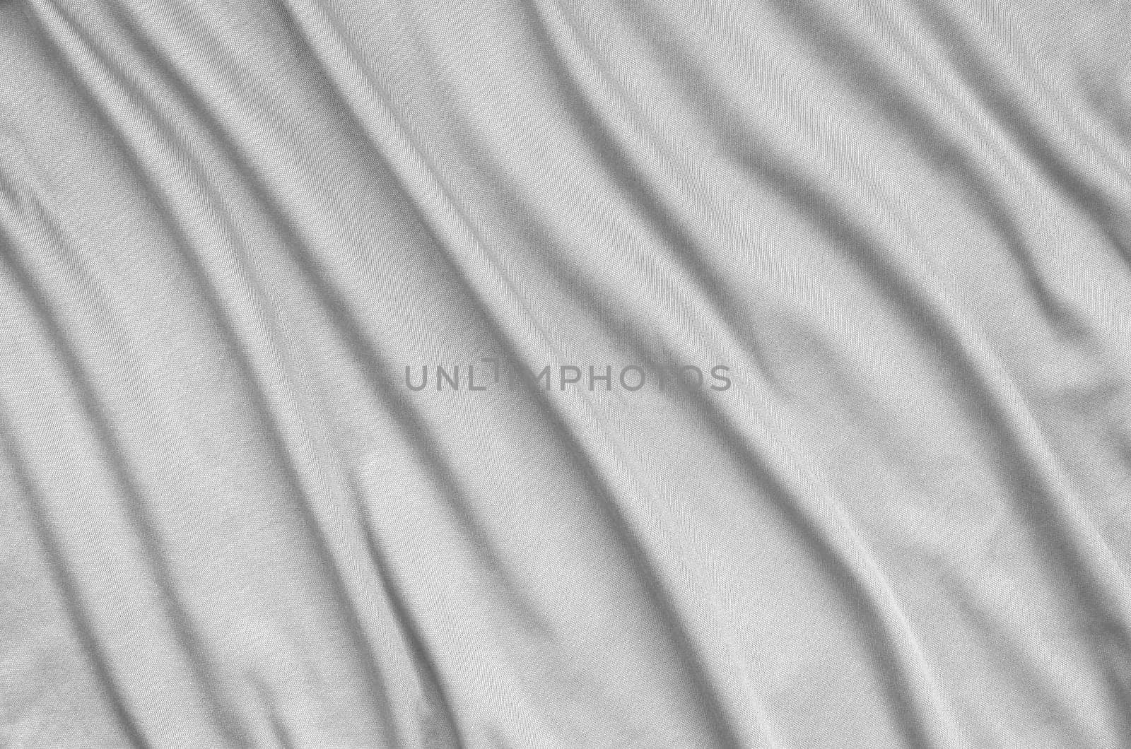 Detailed polyester white fabric texture with many long folds