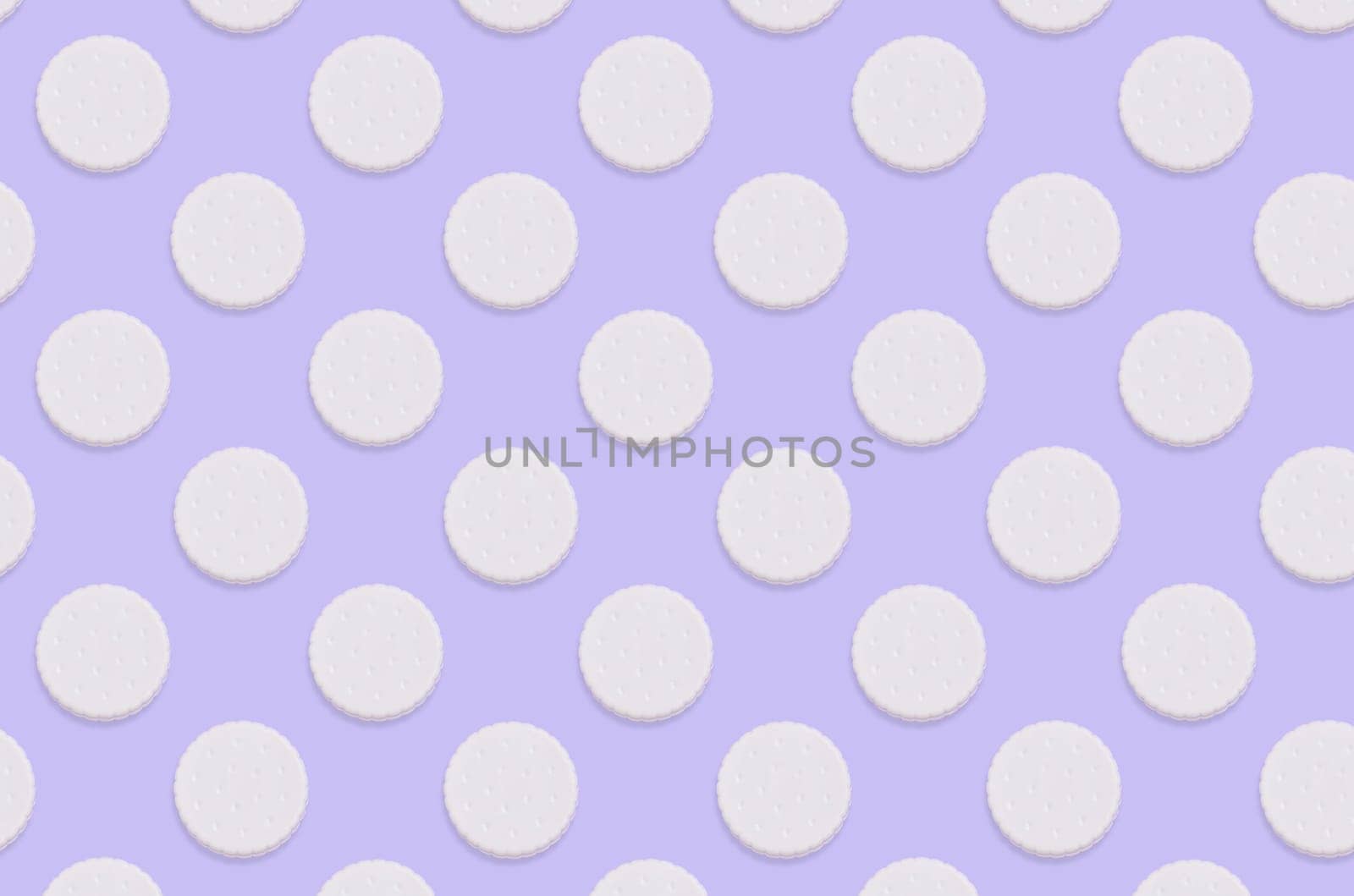 Creative art made with cookies pattern on pastel lilac background. Minimalism flat lay top view