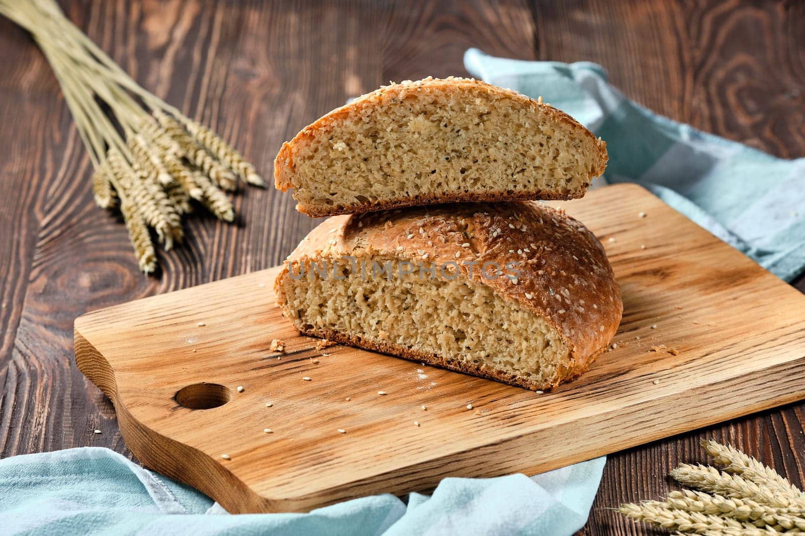 Homemade wheat bread on wooden cutting board