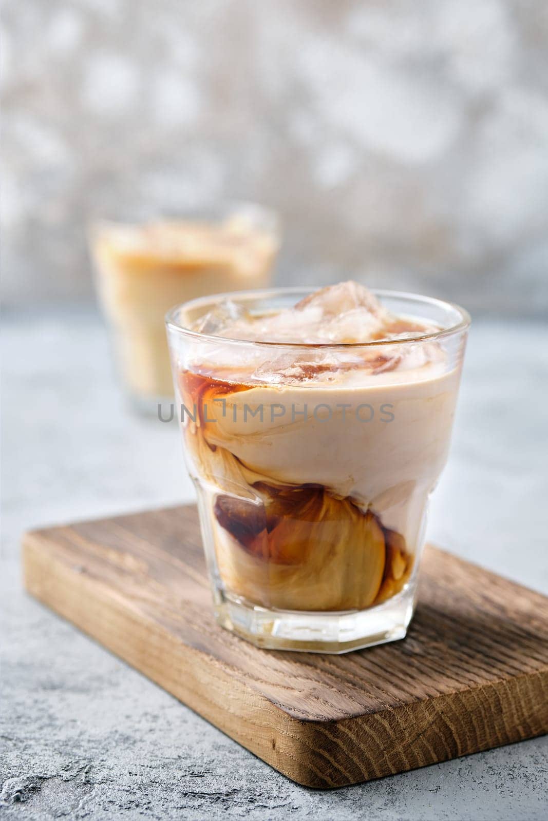 Iced coffee with fat cream in rocks glass