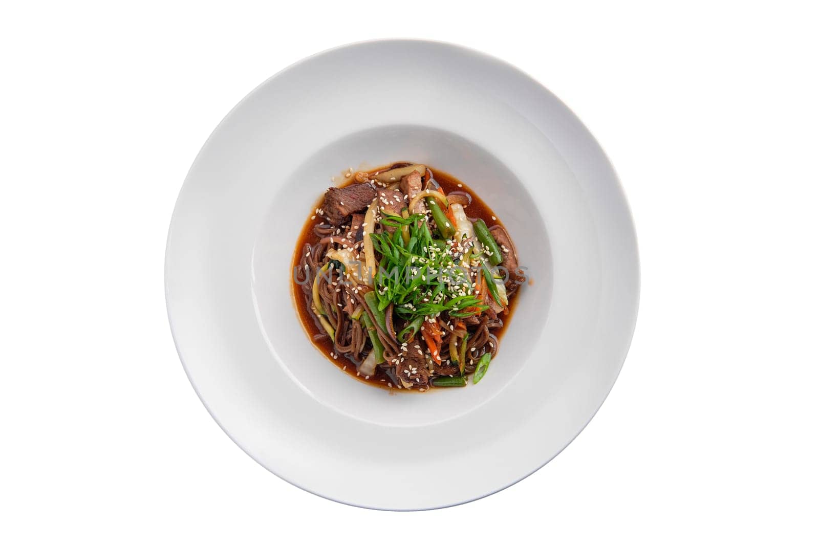 Top view of wok with beef and green beans isolated on white background